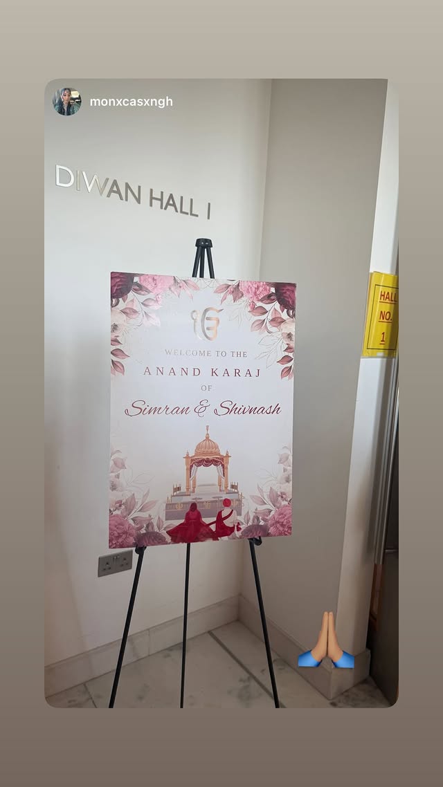 A printed Anand Karaj welcome board displayed on an easel at a venue